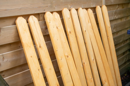 Wooden fence boards covered with colored varnishの写真素材