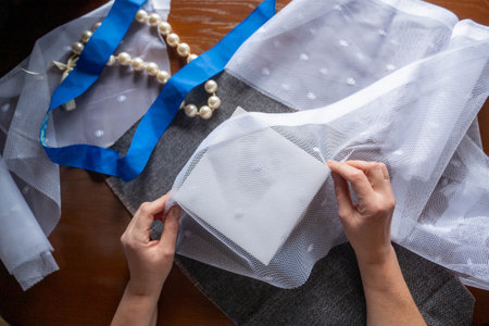 Hands pack the box with eco-friendly materials and recyclable textilesの写真素材