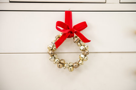 Christmas wreath of bells with a red bowの写真素材