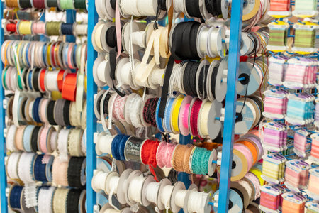 Assortment of colorful ribbons on display in a craft storeの写真素材