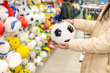 Choose a soccer ball in the store. Assortment of sports ballsの写真素材
