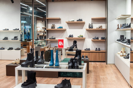 There are women's shoes on the shelf in the store, warm shoes are sold at a discountの写真素材