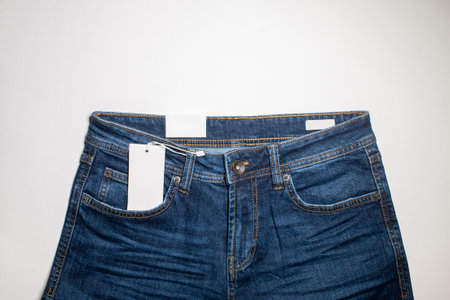 The layout of a white business card in a denim pocket is a fashionable background, a place to copy. The upper part of the trousersの写真素材