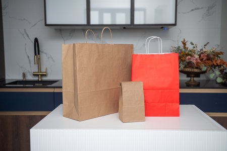 Craft shopping bags are on the kitchen tableの写真素材
