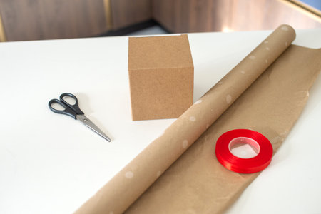 Accessories for packing holiday gifts, scissors and a craft box. Packaging paperの写真素材