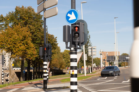 Traffic light-regulated intersection with road signs. Red traffic light. road markingsの写真素材