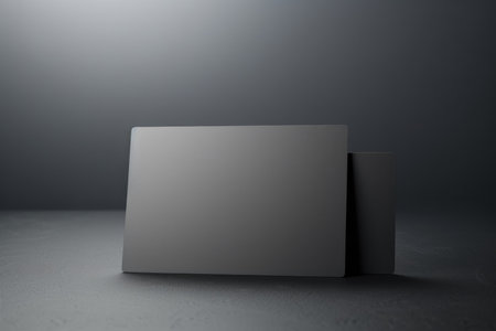 White gift card credit card layout on a gray table backgroundの素材