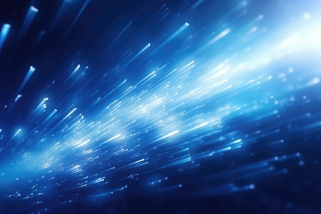 Abstract glowing blue light effect with sparkling rays and stardust particlesの素材