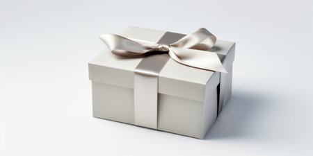 Gift silver square box with a bow, highlighted on a white backgroundの素材