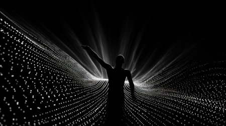 The silhouette of a man standing in a tunnel of dotsの素材