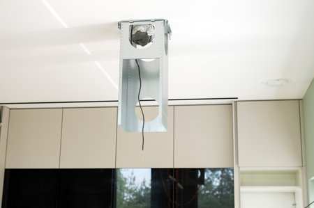 Metal construction for installing a hood on the ceiling in the kitchenの写真素材