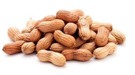 A pile of peanuts on a white surfaceの素材