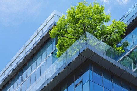 An eco-friendly building in a modern city. Office building made of environmentally friendly glass to reduce carbon dioxideの素材