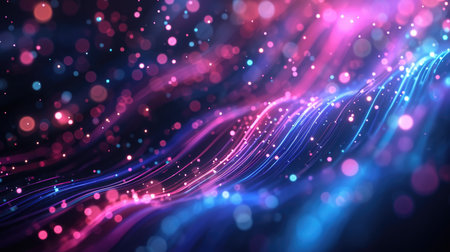 A dynamic abstract of blue and pink fiber optic lights streaming in a dark spaceの素材