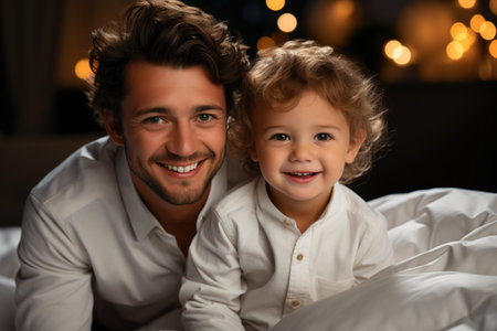 Smiling father and toddler enjoying time together at homeの素材