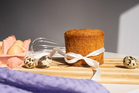 Easter pastries, sponge cake in powdered sugar. Quail and chicken eggs. Place for text