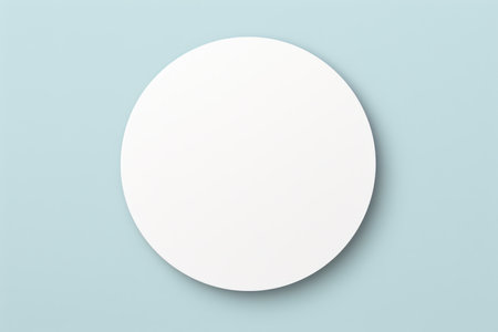 White circular paper blank mockup on a light blue background with copy space. Studio shot for design and printの素材