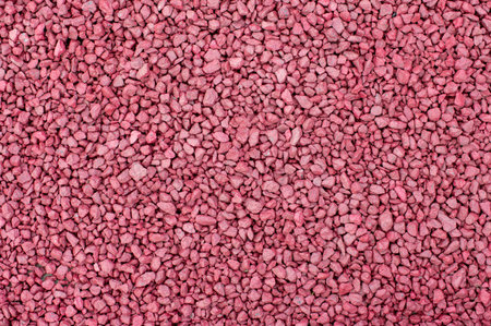 Full frame of pink gravel texture. Natural crushed stone background. Construction and landscaping...