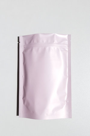 Pink storage bag with metallic texture with zip lock lock. Food bags made of aluminum foil, packaging bags with a zipper flap, for snacks, tea, self-closing bags made of mylar with a zipperの写真素材