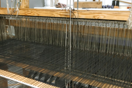 Traditional textile weaving loom in artisan workshop.