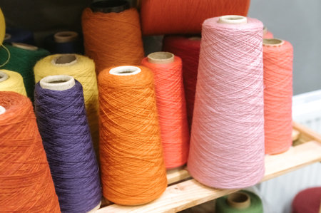 Colorful yarn cones for creative textile and craft projects.
