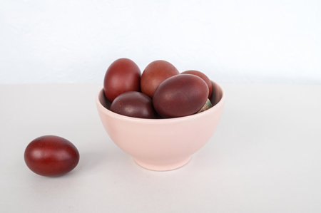 Bowl of brown eggs on white surface.の写真素材