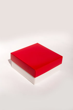 Minimalist red and white box on neutral background highlighting simple design aesthetic.の写真素材