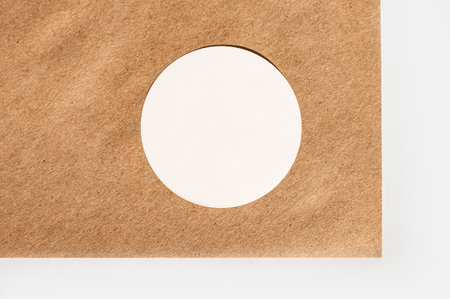 Blank circle on brown cardboard background minimalist design.の写真素材