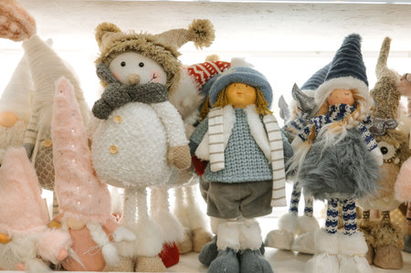 Festive winter decorations featuring adorable snowman and plush figurines.の写真素材