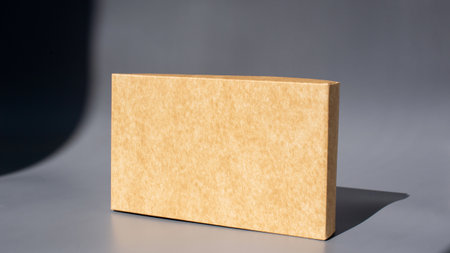 Simple brown rectangular box on gray background.の写真素材