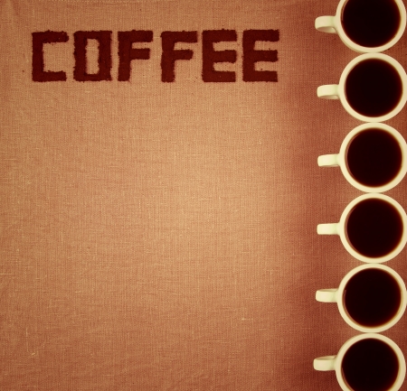 Notebook for coffee menu on saking with coffee cups の写真素材