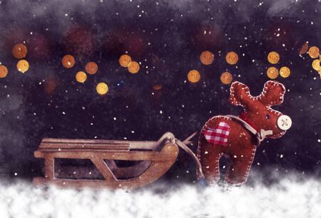 Magic christmas postcard. Deer with empty sleigt at snowing frosty night.の写真素材