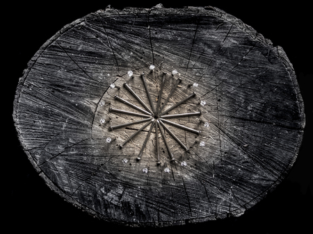 Iron hobnails on the wooden stub. brutal male style. Rings of nails .の写真素材