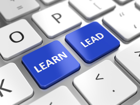 Learn and Lead concept - Learn and Lead key on a computer keyboardの写真素材