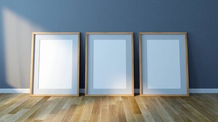 Three Blank picture frames standing on floor. Design Template for Mock Up. 3d renderの写真素材