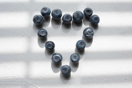 Delicious blueberries formed into a heart shapeの写真素材