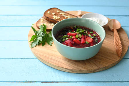 Traditional Ukrainian Russian vegetable soup, borsch with garlic donuts and bread