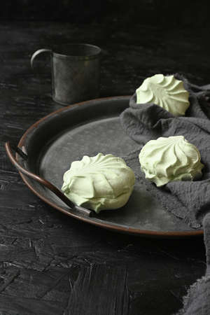 Background of many green russian marshmallows. zephyrの写真素材