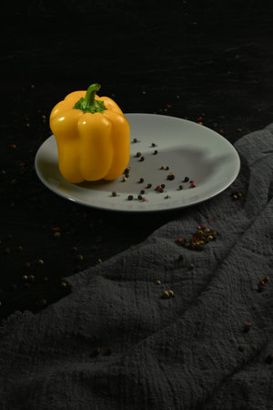 fresh and delicious, yellow peppers black and grayの写真素材
