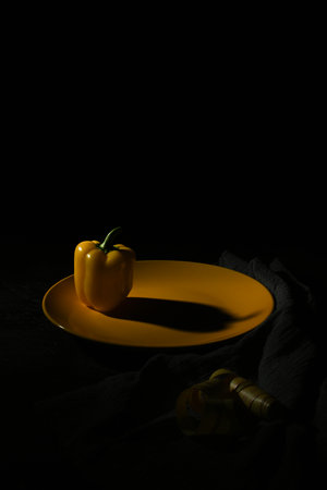 fresh and delicious, yellow peppers black and grayの写真素材