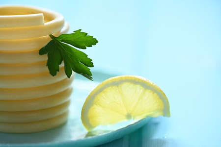 spaghett on a blue plate on blue table with parsley and lemon.の写真素材