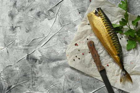 Smoked mackerel fish, on gray background, top view flat lay.の写真素材