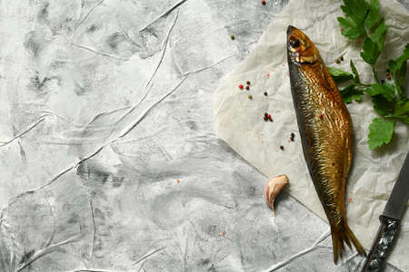 Smoked herring fish, on gray background, top view flat lay.の写真素材