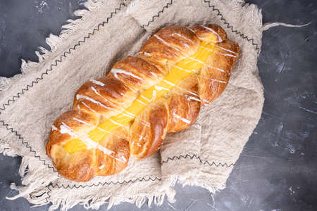 Wheat bread wicker sprinkled on a light background