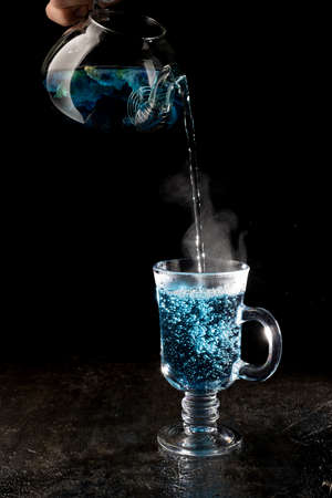 Organic blue tea Anchan, Clitoria, Butterfly Pea on black background.の写真素材