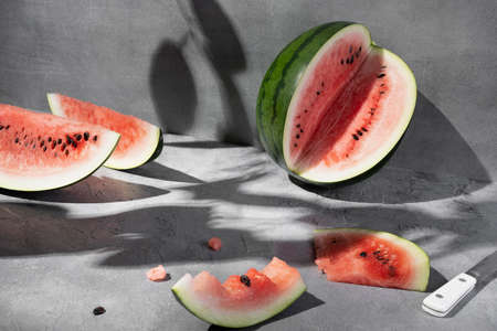 Fresh juicy sliced watermelon on gray background