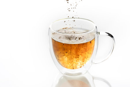 instant coffee is poured into a transparent mugの写真素材