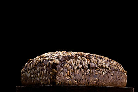 loaf of rye homemade bread in dark background.の写真素材