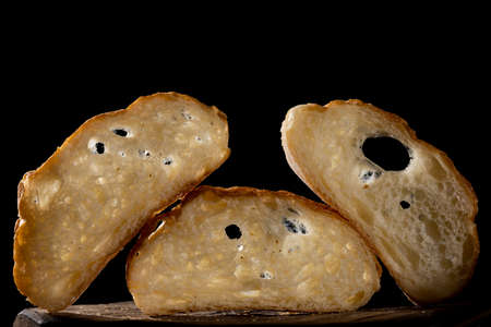 Sliced bread on a Board. On a wooden table.