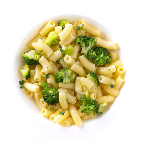 pasta with broccoli on a white plate and white ceramic background.の写真素材